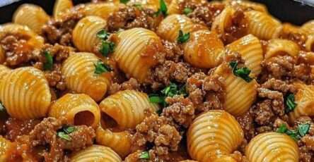 Creamy beef and shells pasta served in a bowl with ground beef, tender shell pasta, tomato cream sauce and melted cheese.