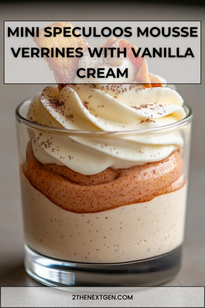 Mini glass verrines layered with creamy speculoos mousse and vanilla whipped cream, decorated with speculoos biscuit pieces and dusted with cocoa powder.