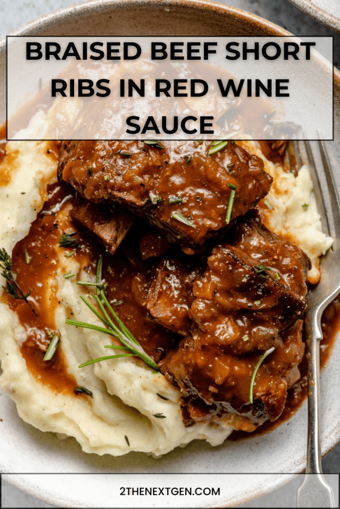 Fork-tender braised beef short ribs simmered in red wine sauce with carrots, onions and herbs, served over creamy mashed potatoes.