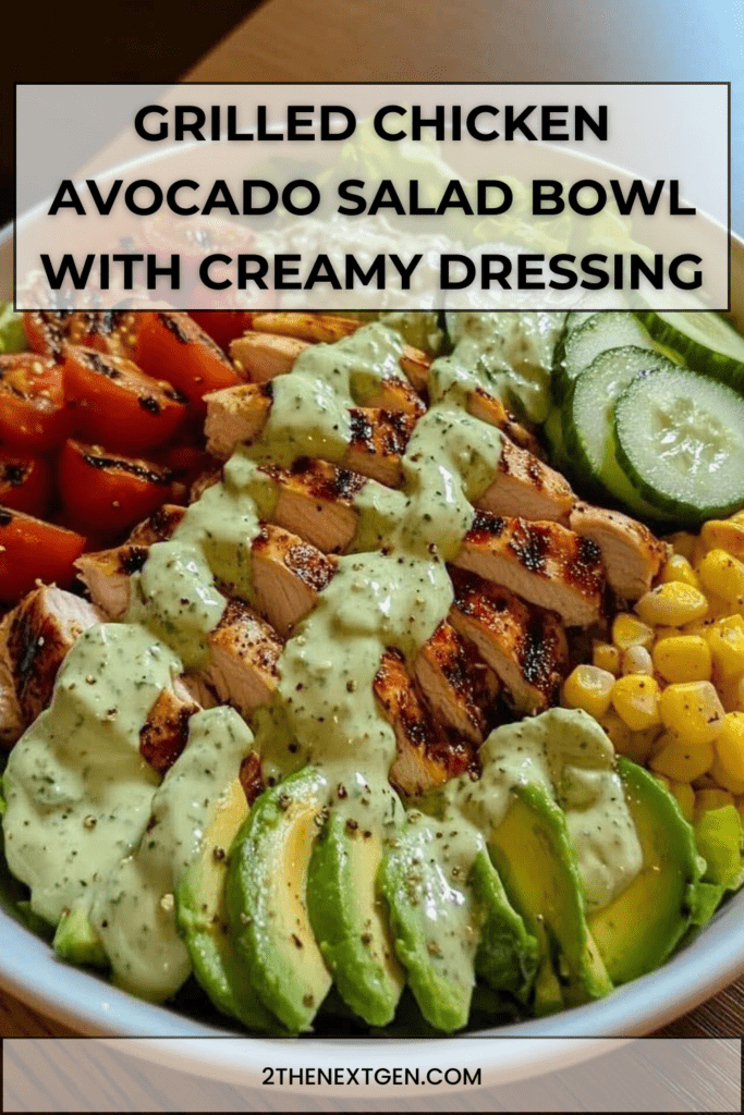 Grilled chicken avocado salad bowl with romaine lettuce, cherry tomatoes, cucumber, corn and creamy avocado dressing served in a ceramic bowl.