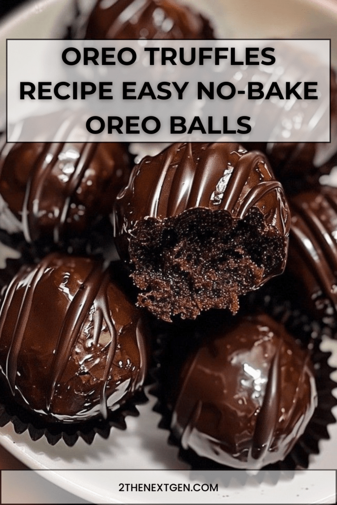 Chocolate coated Oreo truffles arranged on parchment paper with smooth glossy chocolate shell and cookie crumb decoration on top.