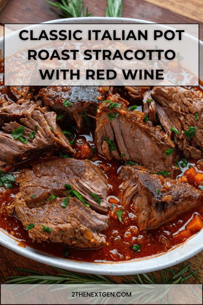 Italian stracotto pot roast braised in tomato and red wine sauce with carrots, celery and herbs served in a rustic Dutch oven.