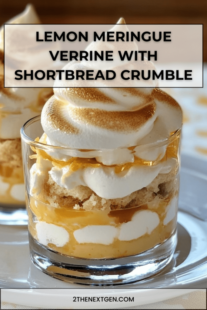 Layered lemon meringue verrine with silky lemon cream, crunchy shortbread crumbs, and golden toasted meringue