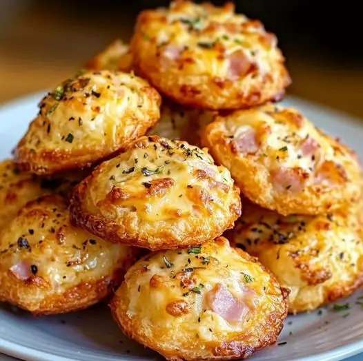 Golden savory Parmesan and Ham Cookies, freshly baked on a parchment-lined tray with a crispy texture