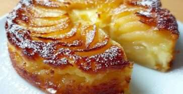Super creamy apple tart with thin apple slices and lightly caramelized golden top dusted with powdered sugar