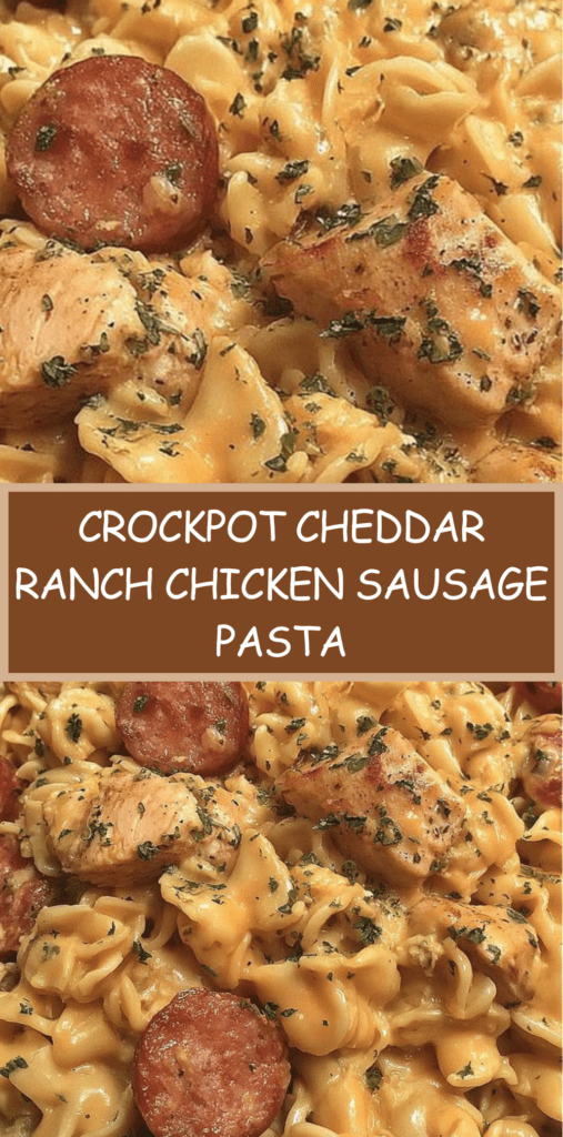 A bowl of crockpot cheddar ranch chicken and sausage pasta with creamy sauce, melted cheese, sliced sausage, and tender chicken pieces garnished with parsley.