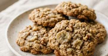 Banana oat cookies recipe served on a plate with soft texture, visible oats, and a healthy homemade look for kids snack time