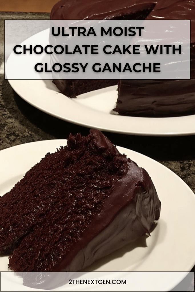 Ultra moist chocolate cake topped with a shiny chocolate ganache, sliced to reveal a soft fudgy center, served on a plate with a smooth glossy finish.