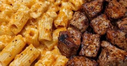 Creamy cheesy rigatoni pasta served with tender garlic butter steak bites, parmesan, parsley, and a rich homemade cheese sauce.
