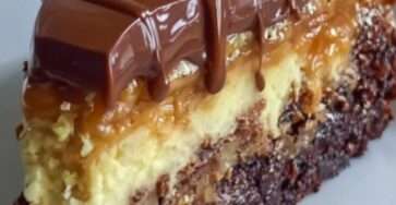 Chocolate caramel cheesecake brownie cake with a fudgy brownie base, creamy cheesecake layer, caramel topping, glossy ganache, nuts, and coconut.