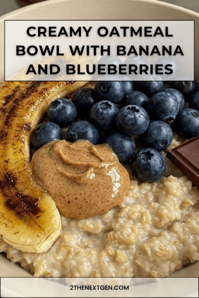 Creamy oatmeal bowl topped with caramelized banana halves, fresh blueberries, peanut butter, dark chocolate, and a drizzle of honey.