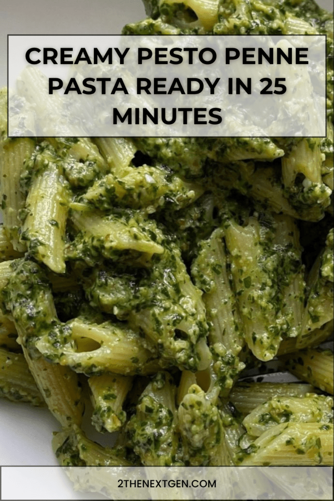 Creamy pesto penne pasta served in a bowl with green basil sauce, grated parmesan, black pepper, fresh basil leaves, and a rich creamy texture.