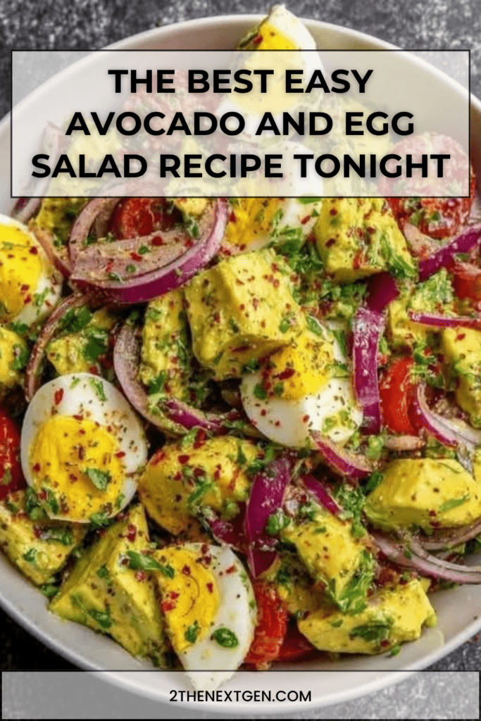 A clear glass bowl filled with a colorful avocado and egg salad, showcasing hard-boiled egg quarters, diced green avocado, red onion slices, and cherry tomatoes.
