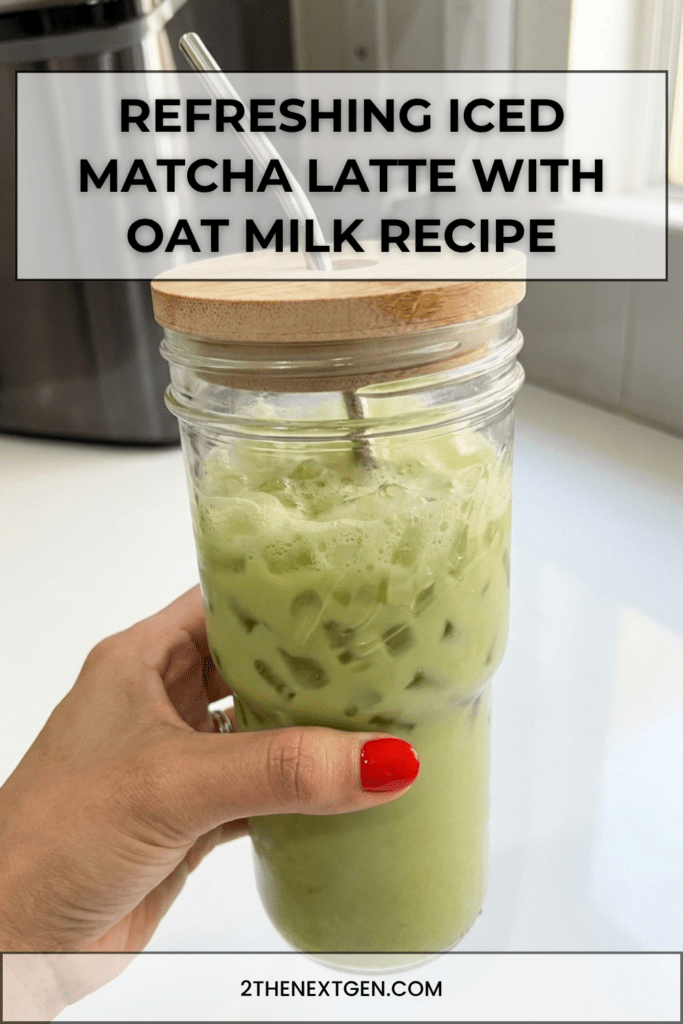 A tall mason jar filled with creamy iced matcha latte made with oat milk and nugget ice. The vibrant green matcha layer swirls beautifully through the milk, creating a marbled effect. The drink is served with a metal straw and lid, making it a refreshing and aesthetic homemade beverage.