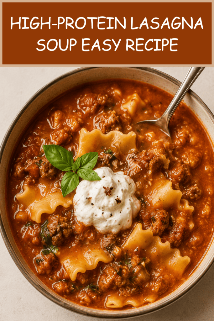 Close-up of high-protein lasagna soup in a bowl with rich tomato broth, tender pasta pieces, lean ground meat, melted mozzarella, cottage cheese, parmesan, and fresh basil.