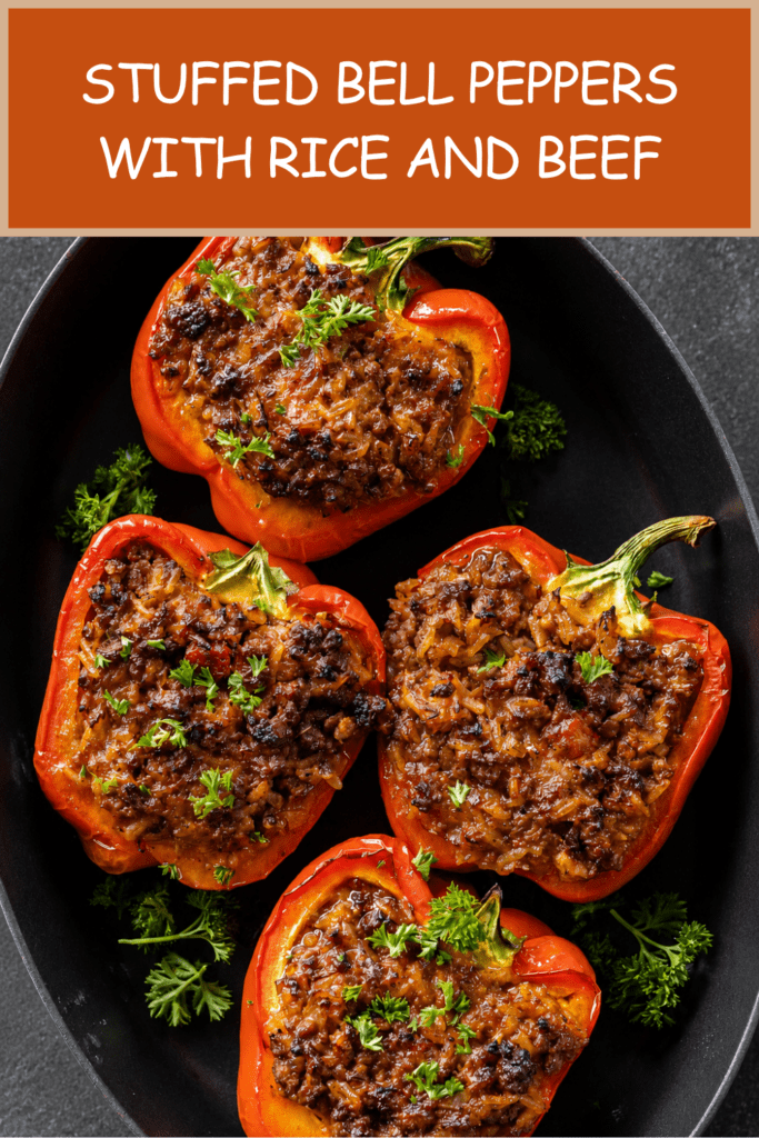 Baked stuffed red bell peppers filled with seasoned ground beef, rice, tomato sauce, herbs, and melted cheese, served hot with fresh parsley on top.