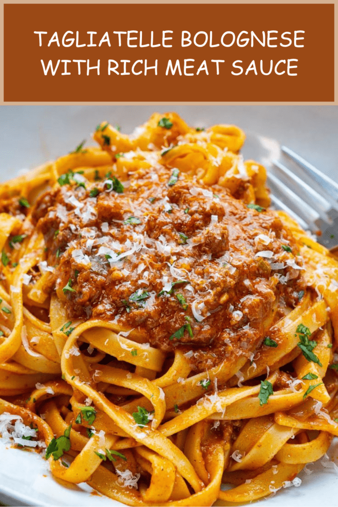Tagliatelle Bolognese served with rich ground beef tomato sauce, grated parmesan, chopped parsley, and black pepper on top.