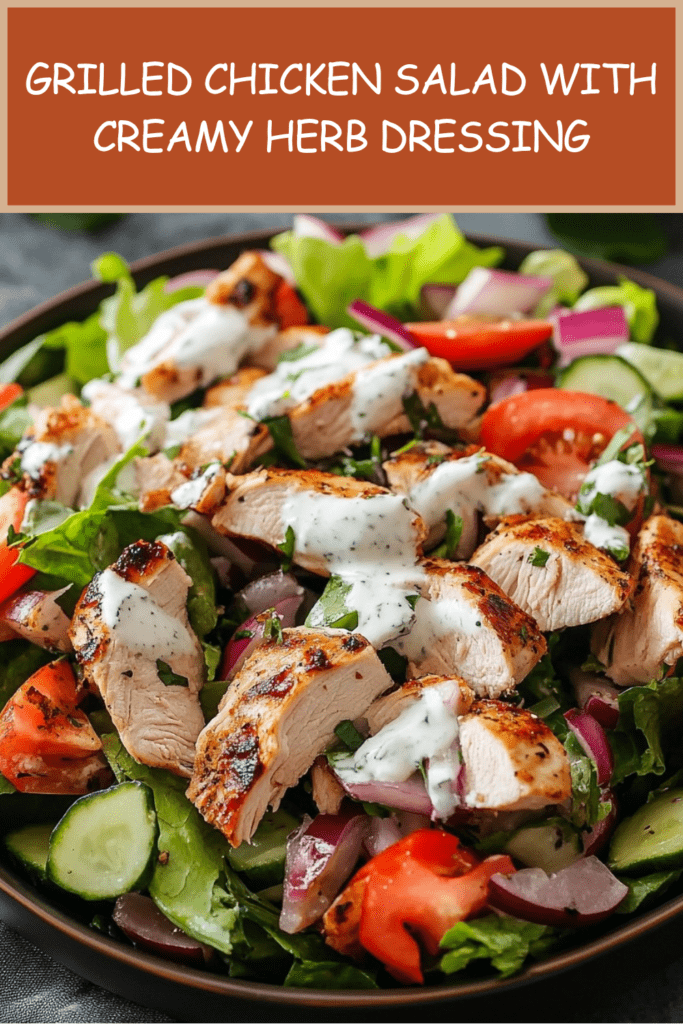 Grilled chicken salad with sliced chicken breast, romaine lettuce, tomatoes, cucumber, red onion, fresh herbs, and creamy herb dressing.