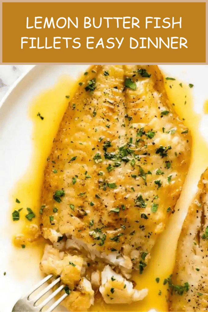 Lemon butter fish fillets served with glossy garlic lemon butter sauce, fresh parsley, lemon wedges, and a side of vegetables.
