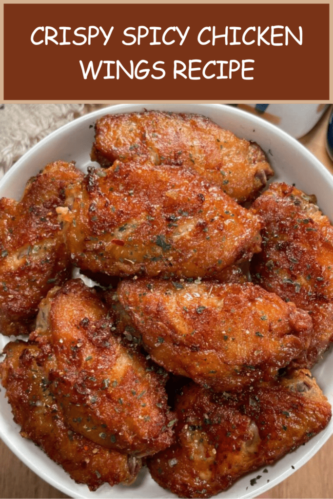 Crispy spicy chicken wings coated in sticky honey hot sauce glaze, sprinkled with parsley and chili flakes, served hot with dipping sauce.
