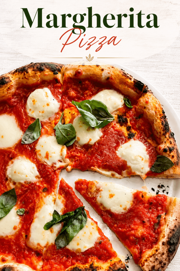 Homemade Margherita pizza with golden airy crust, red tomato sauce, melted fresh mozzarella, basil leaves and a drizzle of olive oil.