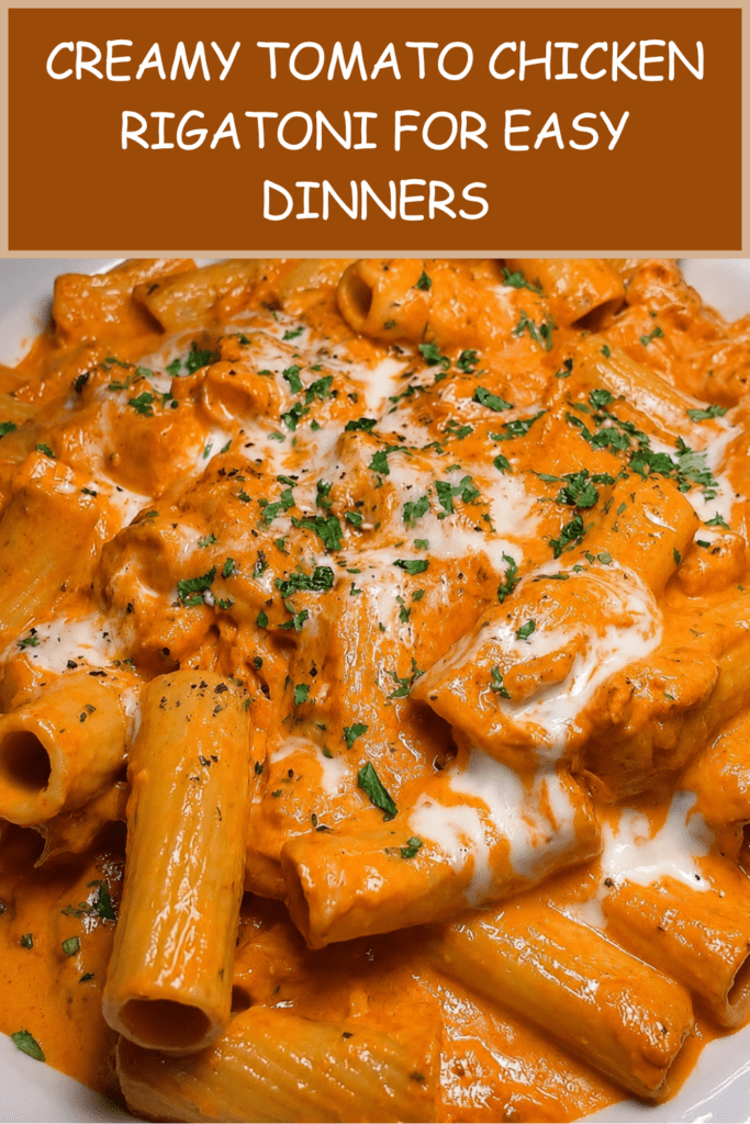 A creamy tomato chicken rigatoni dish served hot with tender chicken pieces, rich tomato cream sauce, melted mozzarella, parmesan, and fresh parsley.