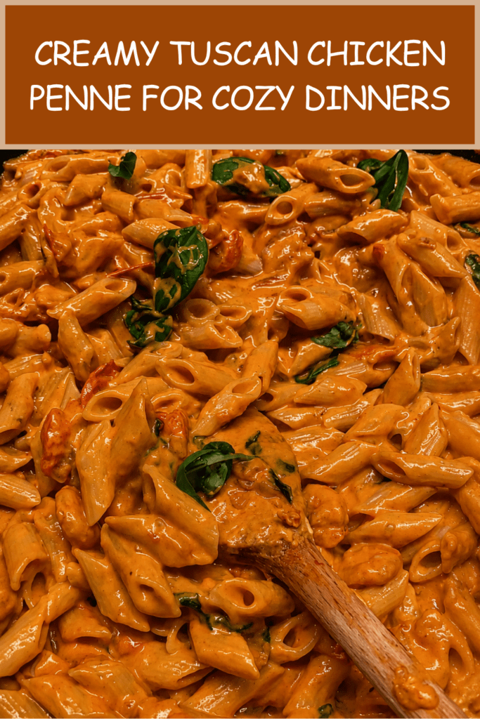 Creamy Tuscan chicken penne served in a bowl with golden chicken pieces, penne pasta, spinach, cherry tomatoes, parmesan, and a rich creamy tomato sauce.