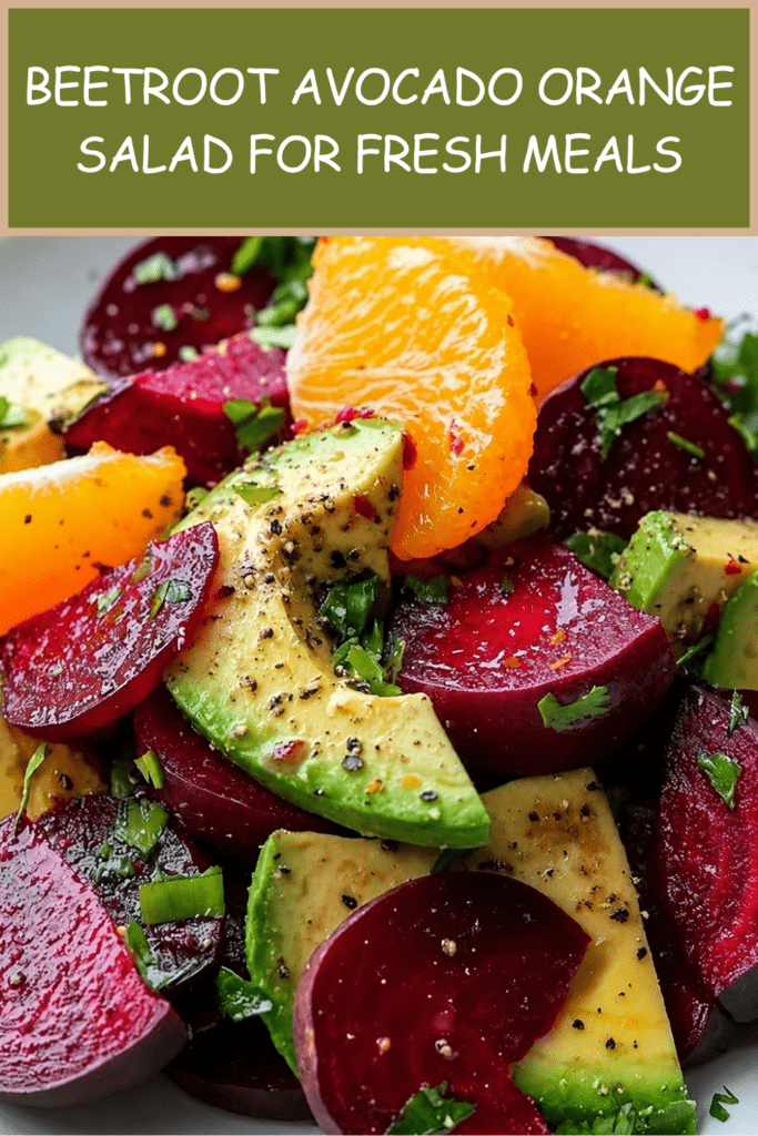 Colorful beetroot avocado orange salad served in a bowl with sliced cooked beetroot, creamy avocado chunks, orange segments, herbs, spring onion, and citrus dressing.