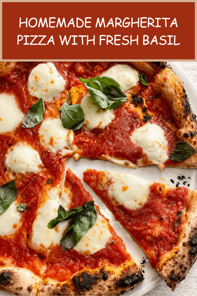 Homemade Margherita pizza with golden airy crust, red tomato sauce, melted fresh mozzarella, basil leaves and a drizzle of olive oil.